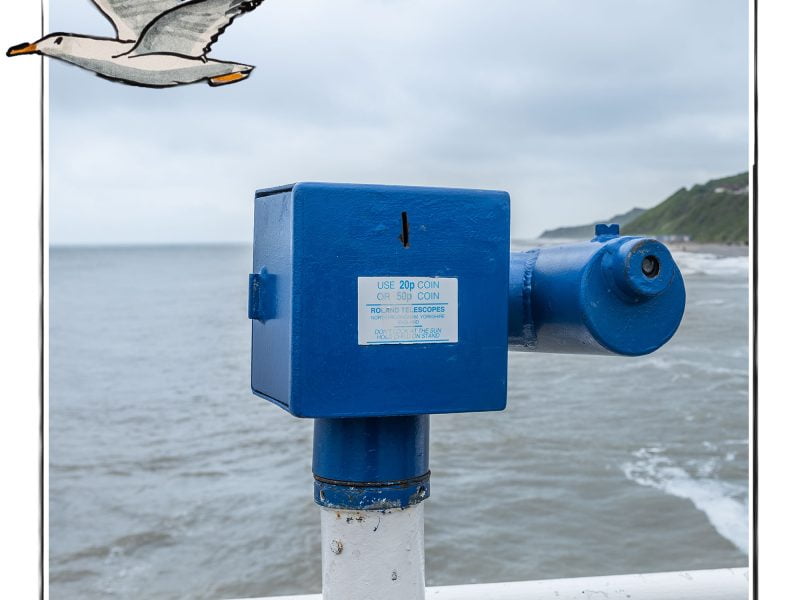 Image of a beach telescope in Norfolk, UK, framed with a sketch line and overlaid with a hand drawn image of a seagull
