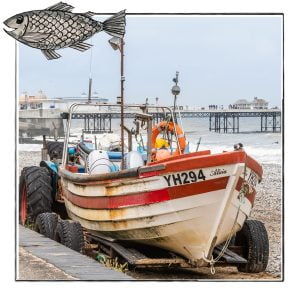 Image of a fishing boat on the beach in Norfolk, UK, framed with a sketch line and overlaid with a hand drawn image of a fish