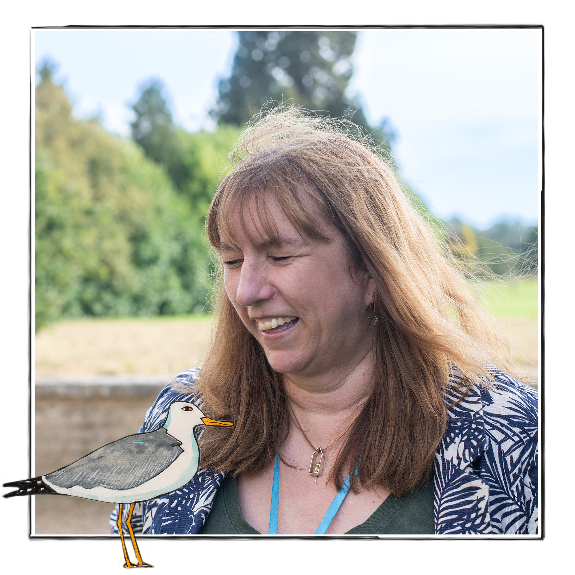 Image of a laughing woman against the background of fields and trees It is framed by a sketch line and overlaid with a hand drawn image of a standing seagull
