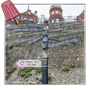 Image of steep steps to the beach in Norfolk, UK, with a signpost at the bottom, framed with a sketch line and overlaid with a hand drawn image of an ice cream